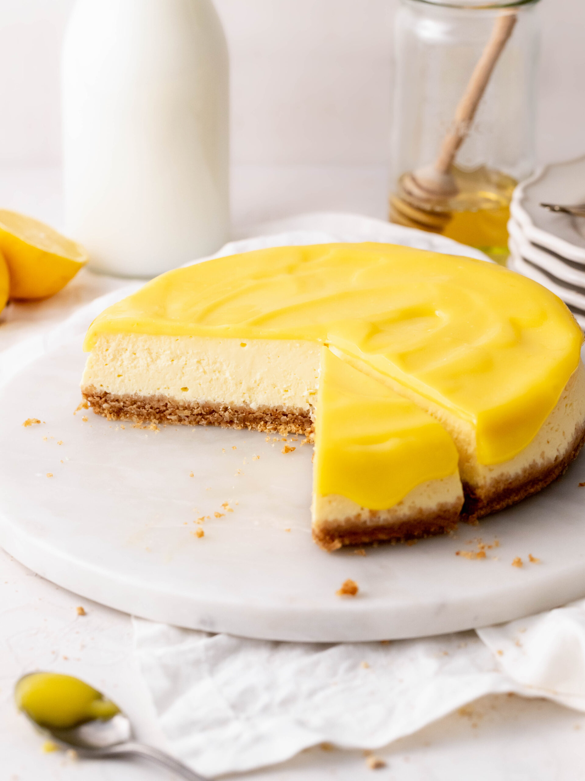 Slices cut into honey and lemon cheesecake.