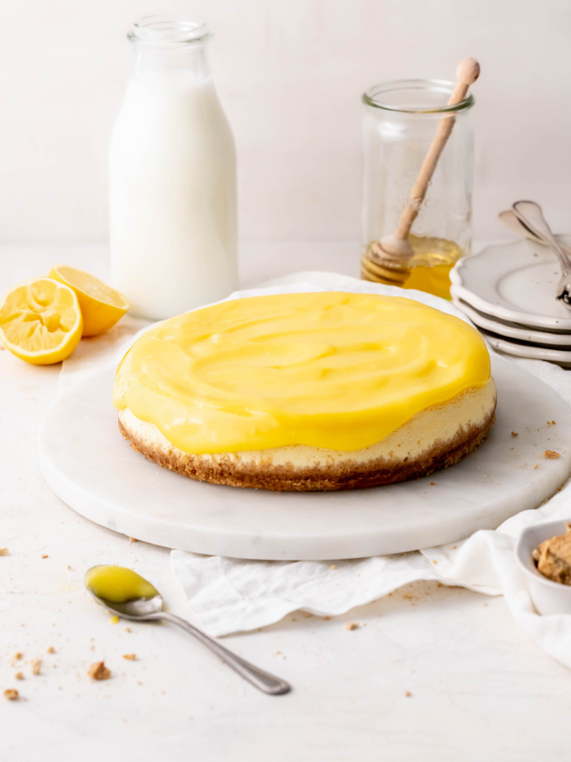 Honey and lemon cheesecake on a cake stand. 