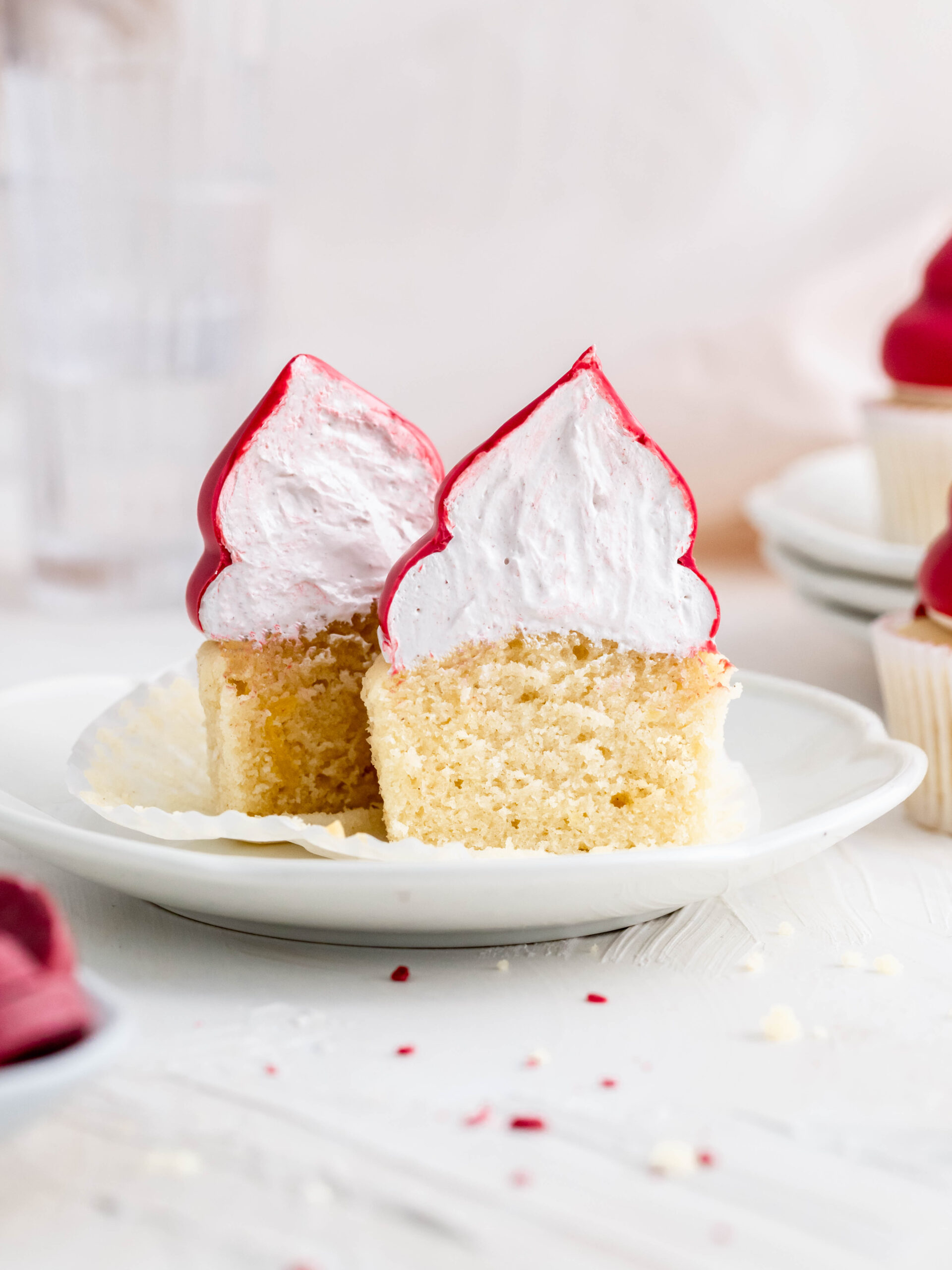 Raspberry cream puff cupcake cut in half. 