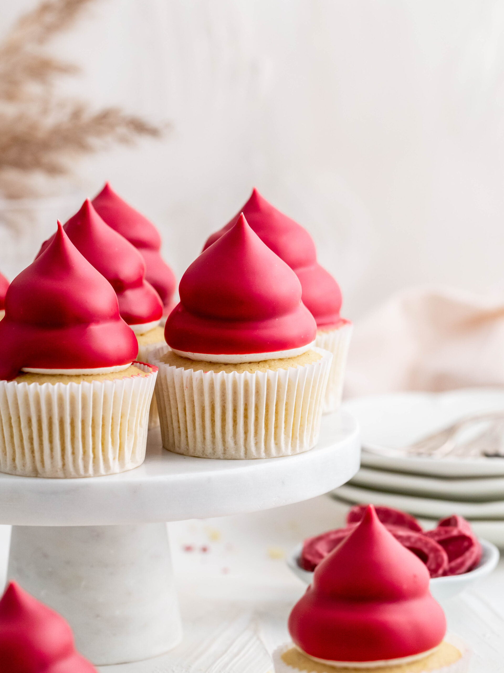 Raspberry Cupcakes on a cake stand. 