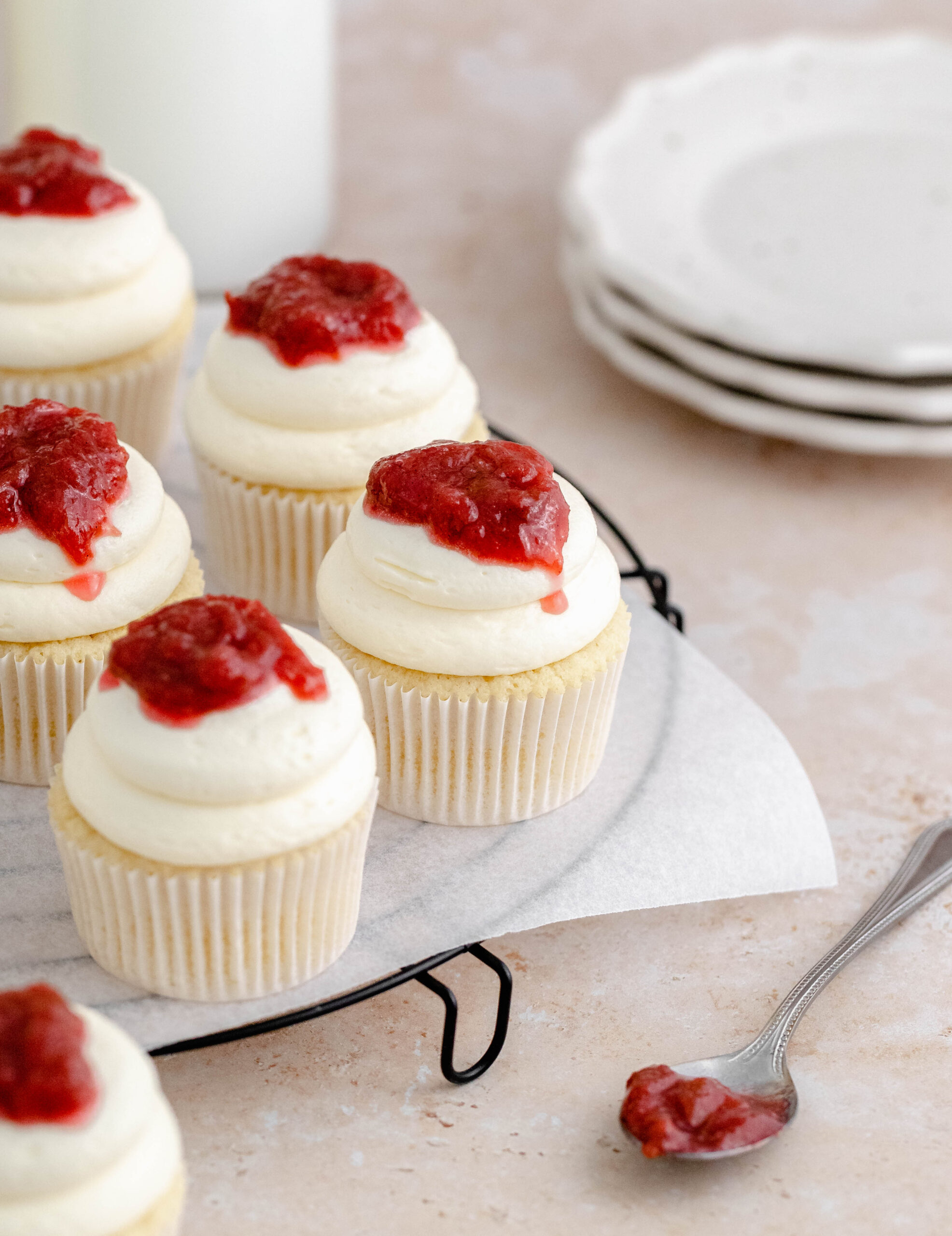 Rhubarb and almond cupcakes on a tray.