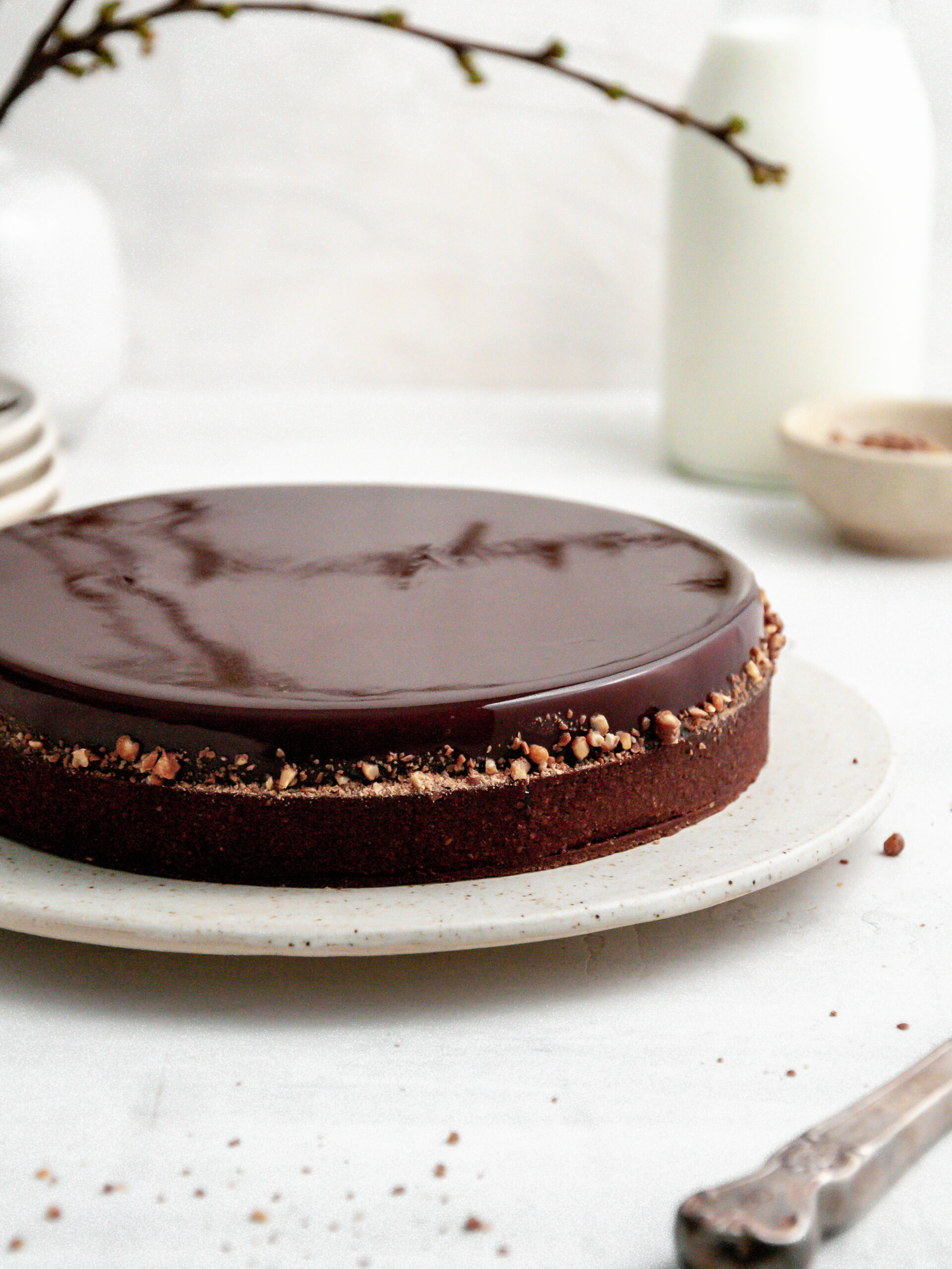 Chocolate Coffee and Caramel Tart on a cake stand.