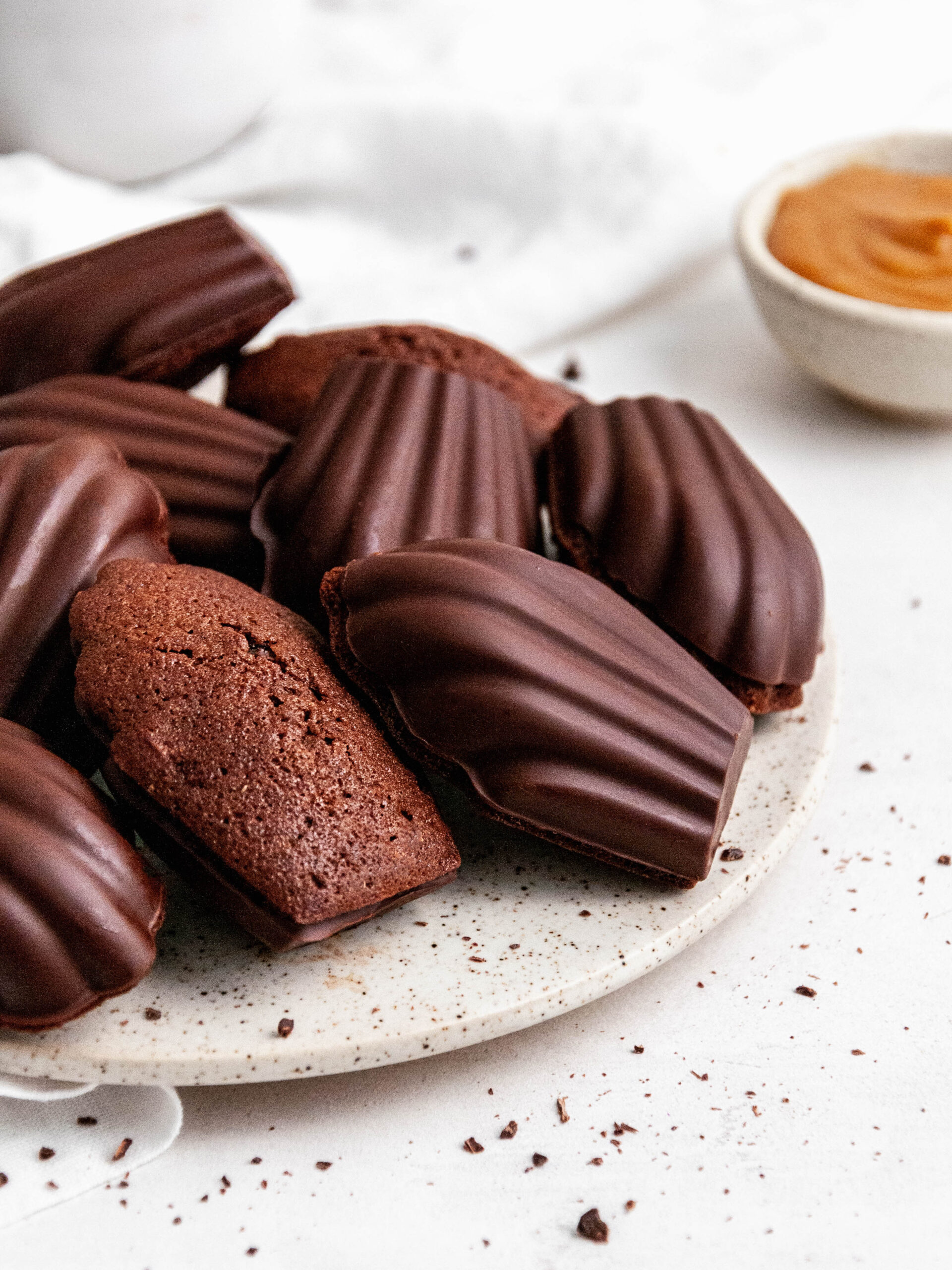 Chocolate madeleines with Dulce de Leche on a plate.