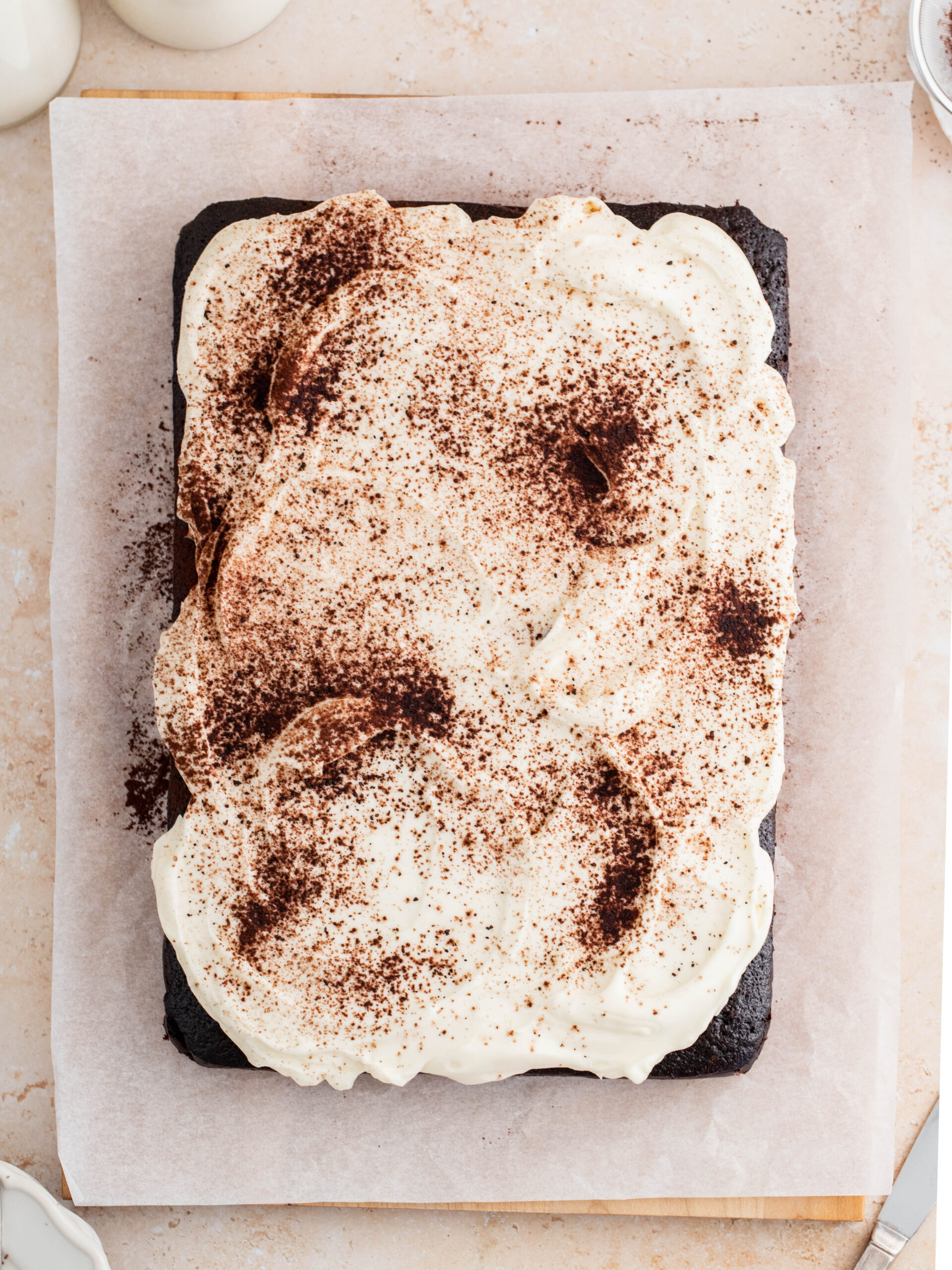 The chocolate mascarpone cake on a cutting board.