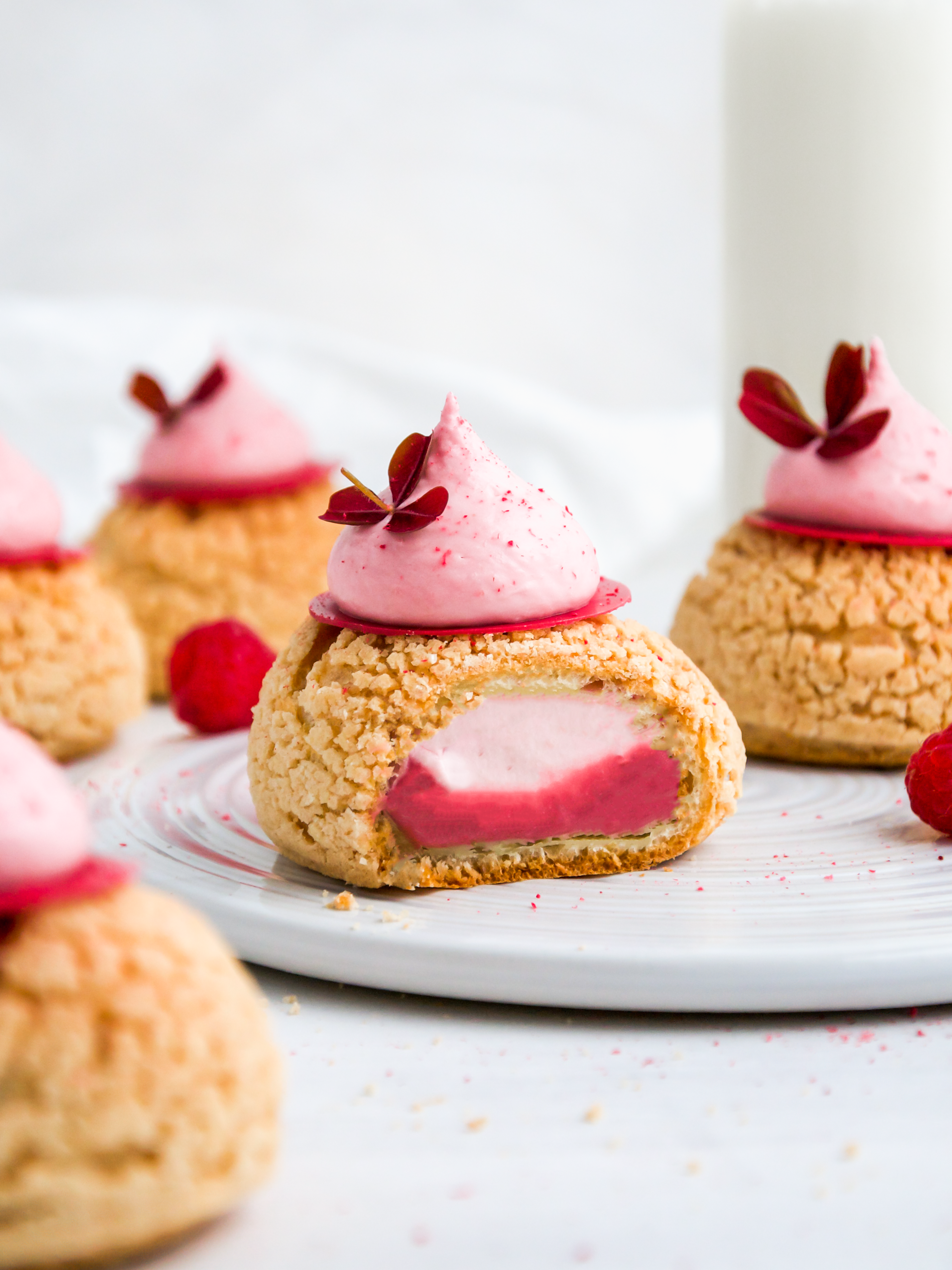 A cut taken of Raspberry Choux au Craquelin.