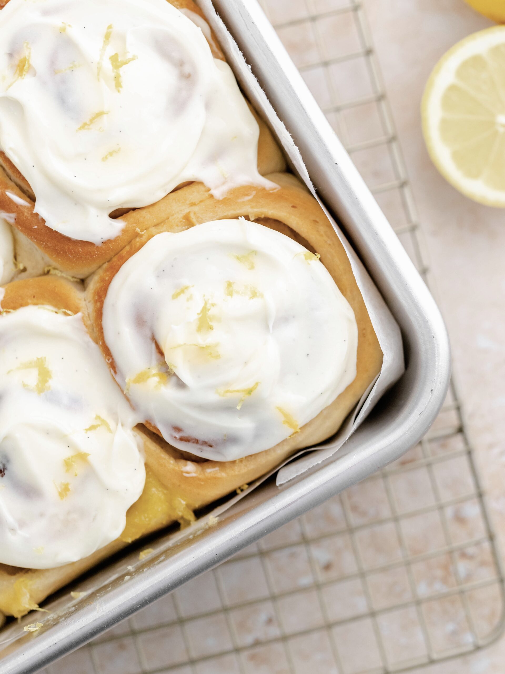 Baked lemon rolls with cream cheese frosting.