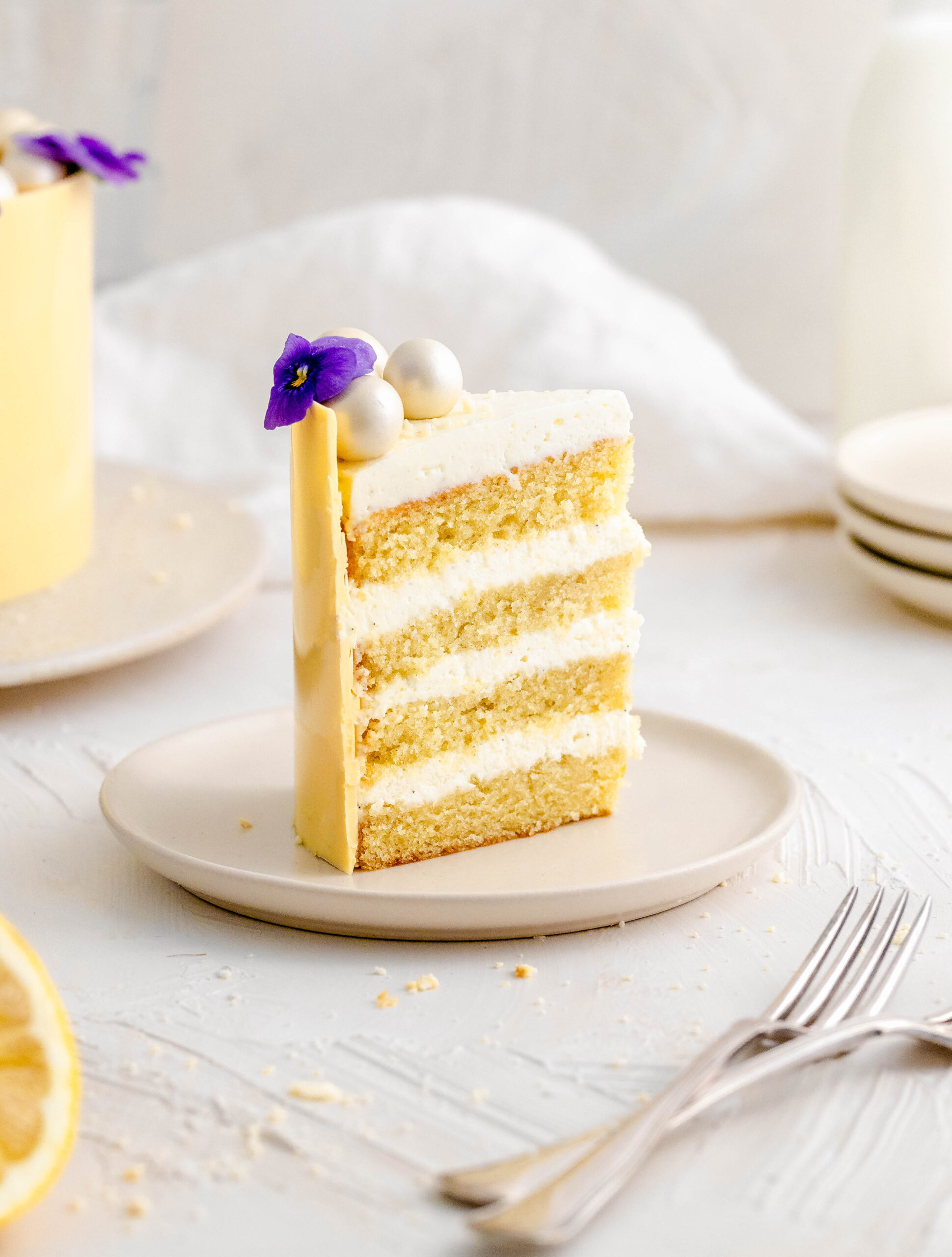 A slice of lemon and mascarpone cake on a plate.