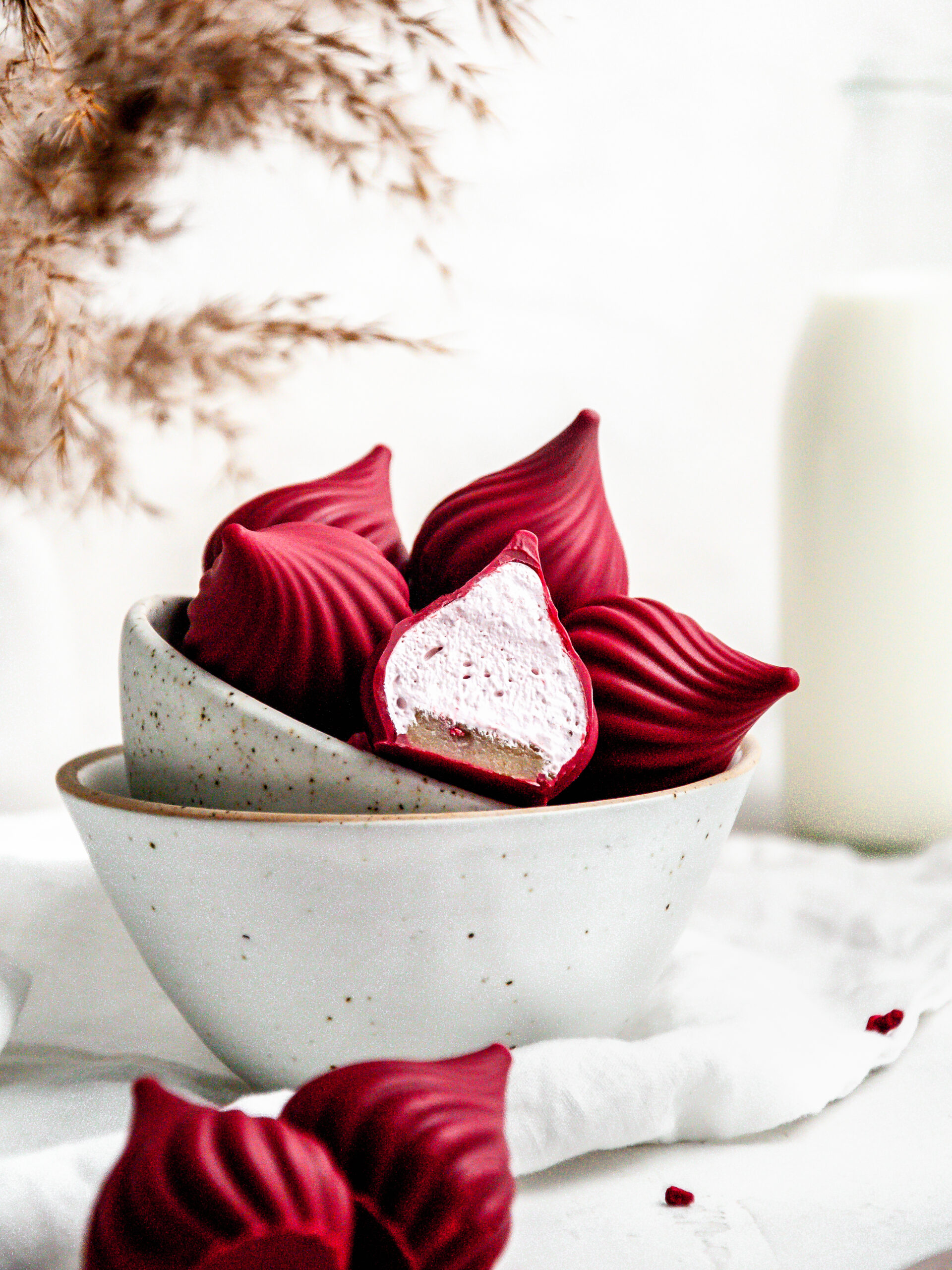 raspberry cream puffs in a bowl.