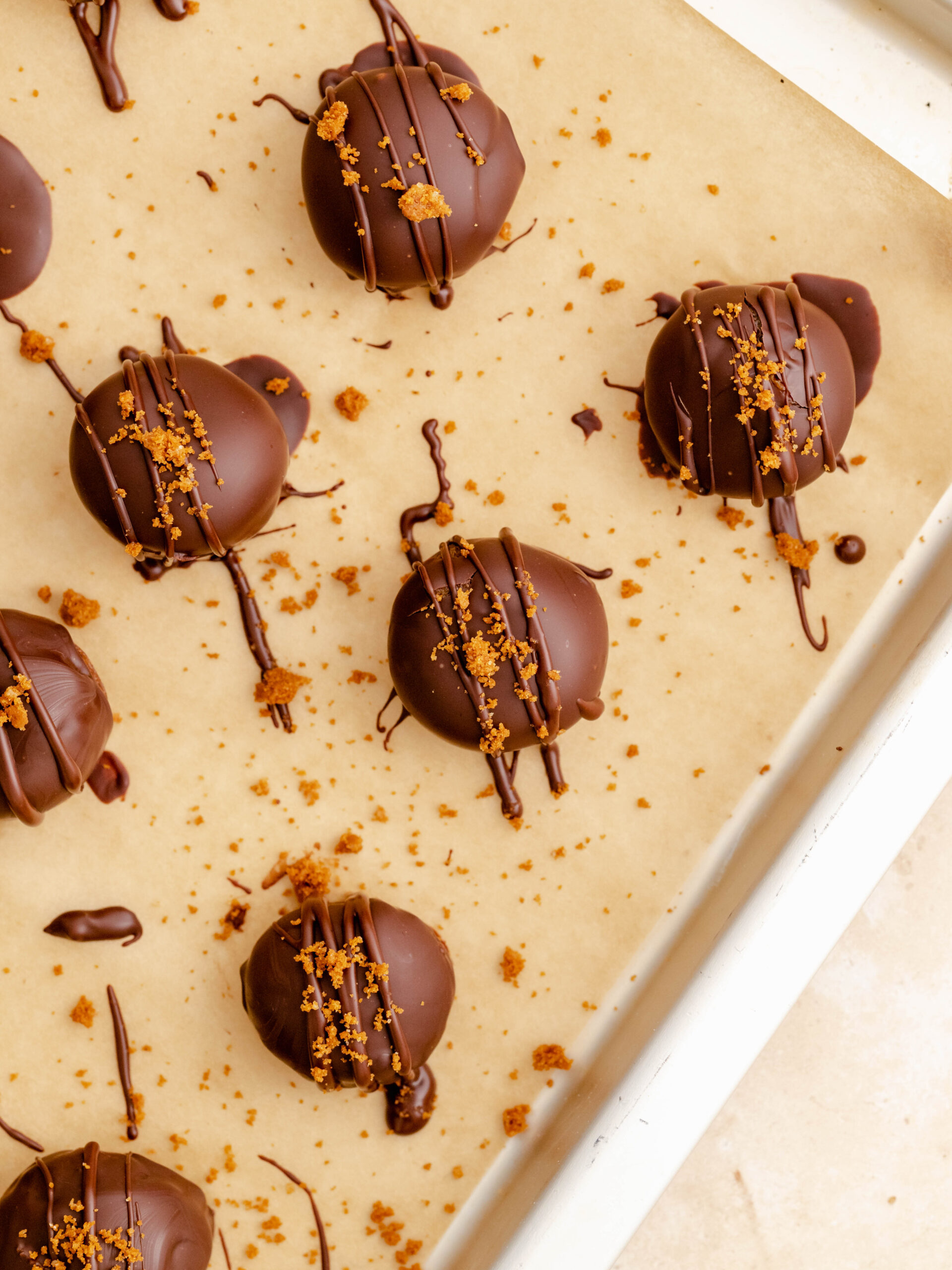 Step 4. Dip them in melted chocolate and drizzle with any left over chocolate and Biscoff crumbs.  