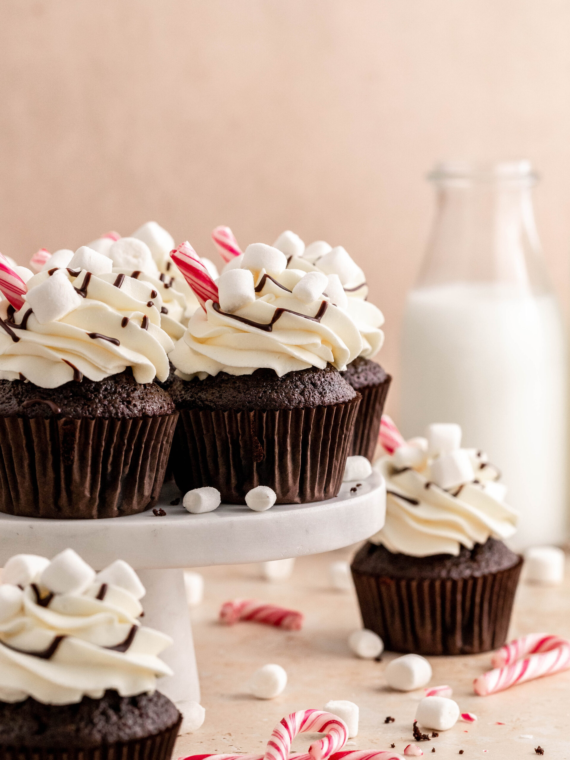 hot chocolate cupcakes on a cake stand.