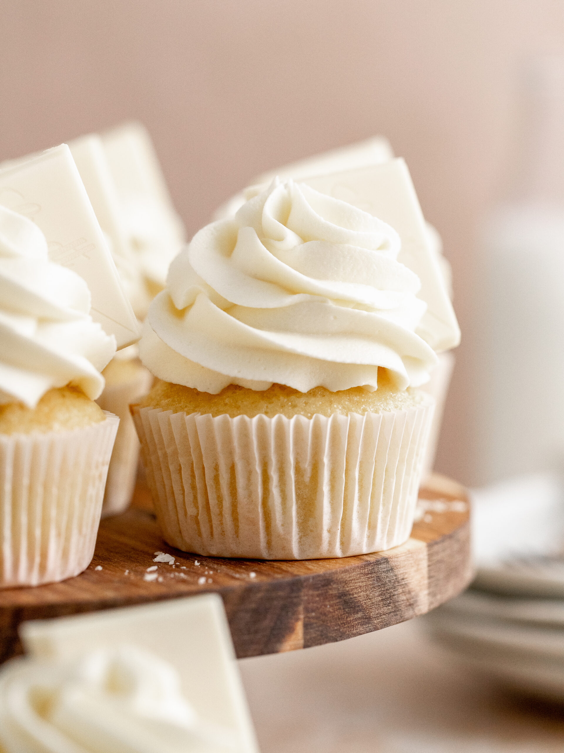 White chocolate cupcakes on a cake stand