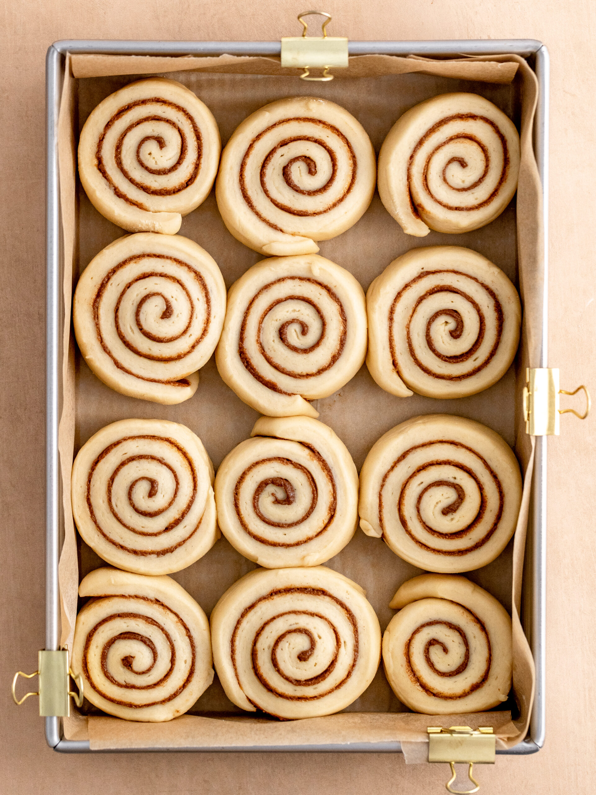 Cinnamon rolls in the baking tray, after the 2nd rise, ready to go into the oven.