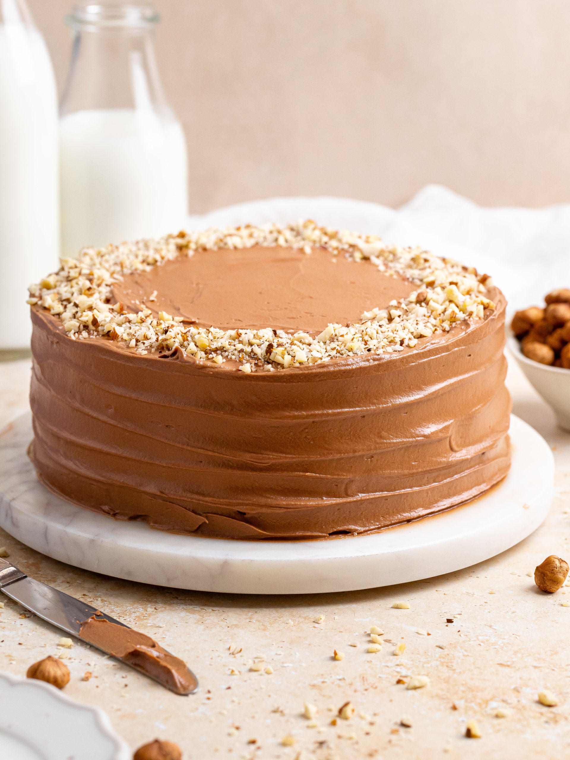 Mill-kċina ta' Pawlina - Easy Baci Cake Quick, easy, and delicious. Line  with parchment paper a 20 cm round container, 220 g crushed plain biscuits,  200 g roasted chopped hazelnuts, 100 g