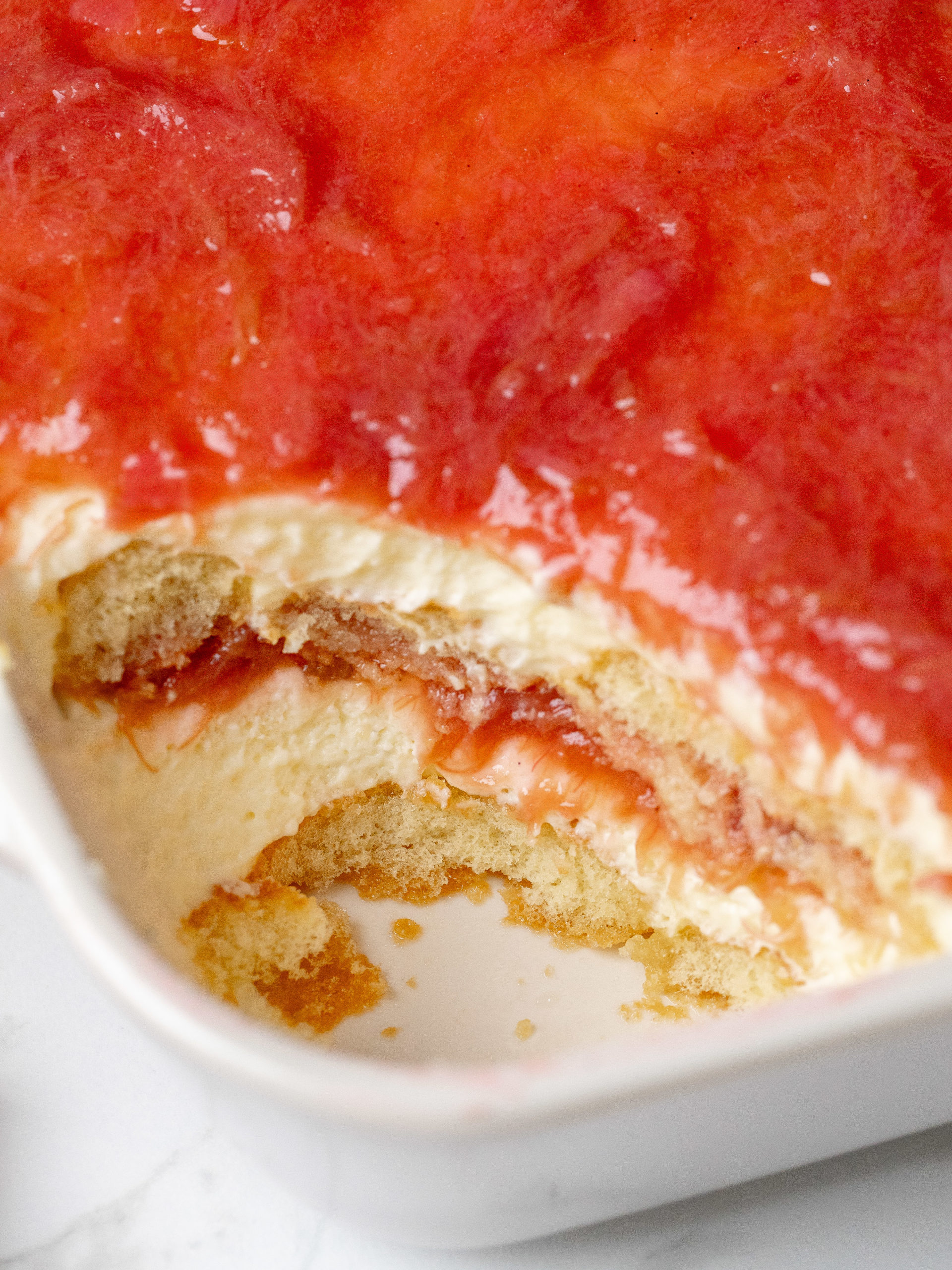Slice of rhubarb tiramisu taken out of the tiramisu 