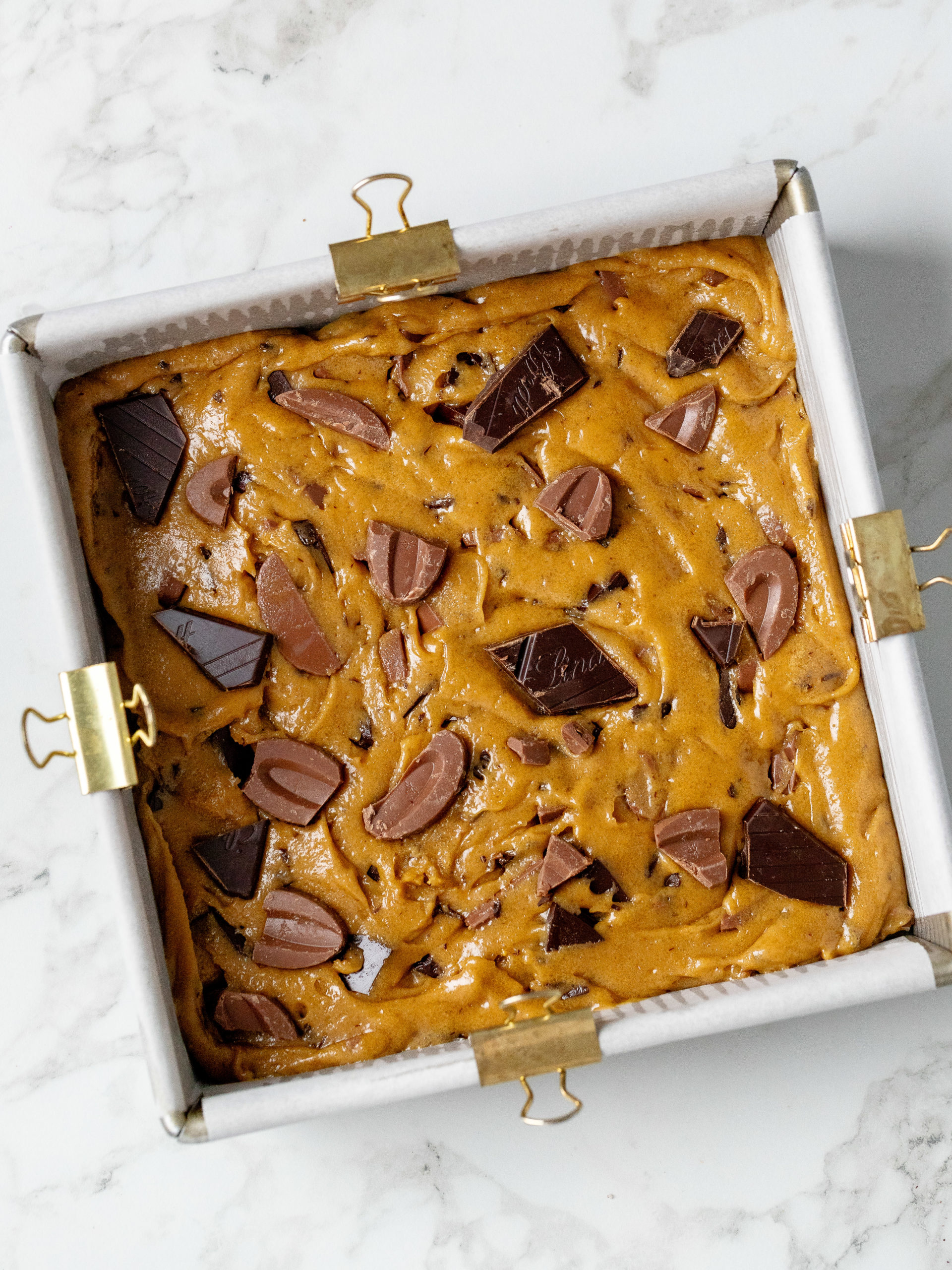 Brown butter blondies dough in baking pan before baking.